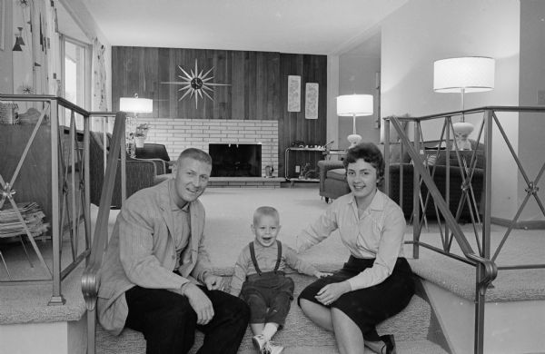 Mr. and Mrs. Harold F. (Schim) Elliott and son Michael in the living room of their house built as their "dream home" from plans in the <i>Wisconsin State Journal</i>.