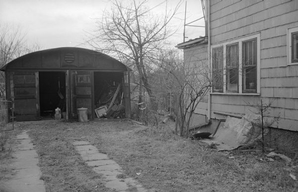 The side yard of the Frances Burnett Gallagher residence at 2129 Center avenue. The owner who owns four other properties in that block has received many complaints for code violations.