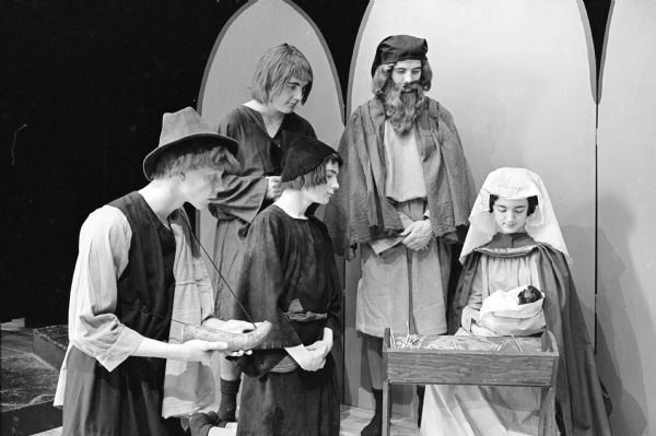 Edgewood High School presents a medieval nativity play in the school auditorium. Members of the cast are (lower, L-R) John Rengstorff, shepherd, son of Mr. & Mrs. Charles Rengstorff, 2321 W. Lawn Court; Michael Powers, shepherd, son of Mr. and Mrs. Francis Powers, Oregon; Sandra Mitchell, playing the role of Mary, daughter of Mr. and Mrs. Cliff Knutson, 627 W. Lakeside Street; (standing, L-R) John Lynaugh, shepherd, son of Mr. and Mrs. Francis B. Lynaugh, 820 Woodrow Street; and Thomas Brophy, playing the role of Joseph, son of Mr. and Mrs. James Brophy, 136 Proudfit Street.