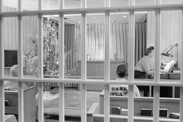 Deputies decorated a Christmas tree in the Dane County jail chapel and jail matron Anne Frazier played the chapel organ for prisoners meditating in the chapel.     
