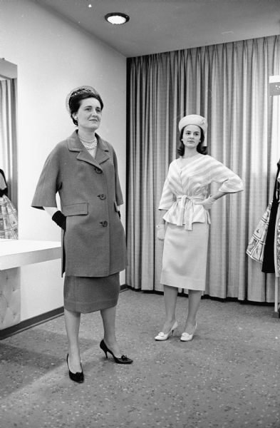 Two members of Grace Episcopal Church model for the style show that will precede the annual Rector's Guild dance. Patricia Hefty is on the left and Jacqueline Harman, who is president of the Kemper club, a young people's organization at the church, is on the right.