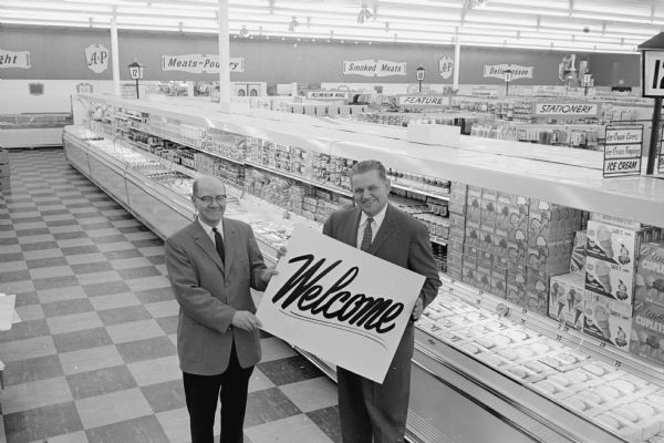 Manager Ralph Johnson, left, and supervisor Richard Brye stand in an aisle of the new A and P supermarket to open on Wingra Drive.