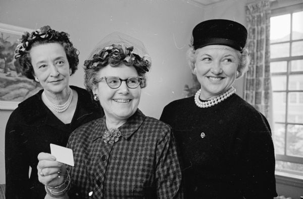 The annual meeting of the Women's Auxiliary at Madison General Hospital, 925 Mound Street, is held at the hospital. Shown (L-R) are: Mrs. A. L. Small, 2110 Kendall Avenue, program and publicity chair; Mrs. Henry Carter, 4325 Herrick Lane, secretary; and Mrs. Charles Shelby, 5102 Coney Weston Place, treasurer.