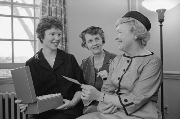 The annual meeting of the Women's Auxiliary at Madison General Hospital, 925 Mound Street, is held at the hospital. Shown (L-R) are: Mrs. W. Jerome Frautschi, 705 Woodward Drive, gift shop chair; Mrs. A. R. Colbert, 138 Oneida Place, pediatrics chair; and Mrs. Eugene R. McPhee, 2214 Chadbourne Avenue, social service chair.