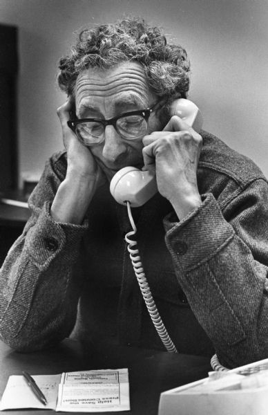 Activist Clarence Kailin speaking into a telephone.