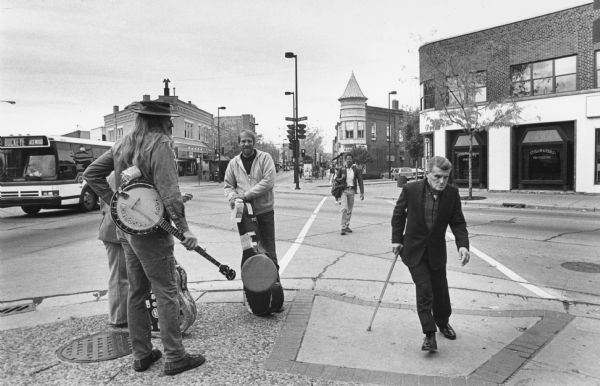 A group of musicians gathered on the corner of State and W. Johnson Streets. 