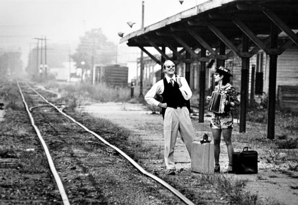 Steve Miller and Lisa Davis traverse the tracks at the West Washington Avenue train station.