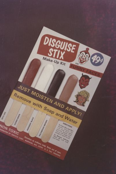 Shrink wrapped package of the original Disguise Stix©, the body paint developed by Gene Coffman, of Gratco Corporation.