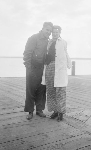 Sid Boyum standing with his sister, Bernice Boyum Bergner, on a dock on a lake.