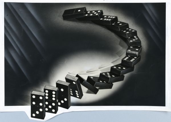 Illustrative art of dominoes falling in an "S" curve.