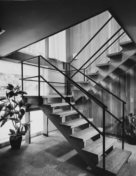Edward Bloom House, Keck and Keck Project #625. Project date 1959. George Fred and William Keck were born in Watertown, Wisconsin, and operated an architectural office on Michigan Avenue in Chicago, Illinois. This is a photograph showing an exposed, interior stairway in the Bloom house in North Muskegon, Michigan.
