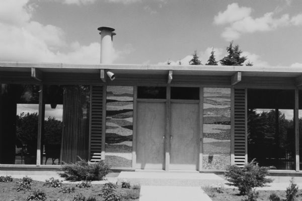 The Bortin House, designed by George Fred and William Keck for the Mortimer M. Bortin family in 1958. This is Keck and Keck Project #610, built on E. Juniper Street in Mequon, Wisconsin. This photograph shows tile inlay and ventilation louvers at the front entrance to the house. 