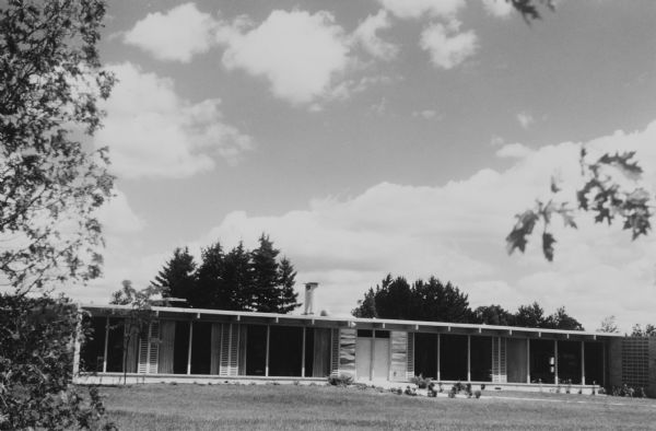 The Bortin House, designed by George Fred and William Keck for the Mortimer M. Bortin family in 1958. This is Keck and Keck Project #610, built on E. Juniper Street in Mequon, Wisconsin. This photograph shows the front face of the house, including the distributed ventilation louvers used in many of Keck and Keck's designs.