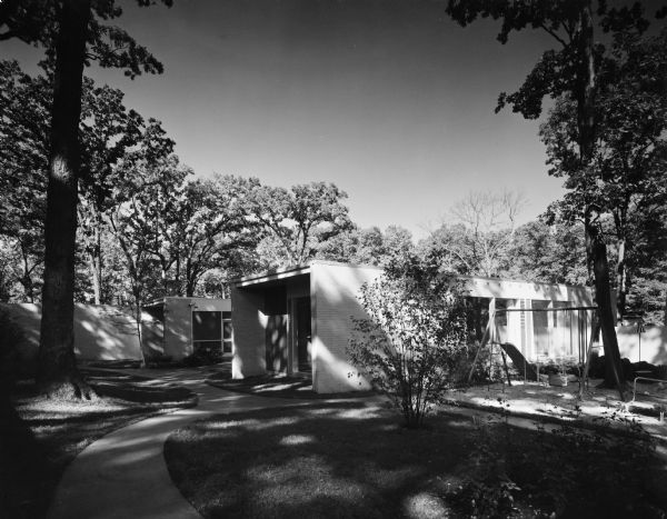 The Armen and Dorothy Avedisian House was designed by the architectural firm Keck and Keck as Project #597 in 1958. George Fred and William Keck were born in Watertown, Wisconsin, and operated an architectural office on Michigan Avenue in Chicago, Illinois. Armen Avedisian was a very successful Chicago industrialist. This photograph shows the front perspective of the Avedisian house on Taft Road in Hinsdale, Illinois. 