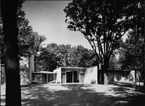 Edward McCormick and Elizabeth Blair House, Keck and Keck Project #500. Project date 1953. George Fred and William Keck were born in Watertown, Wisconsin, and operated an architectural office on Michigan Avenue in Chicago, Illinois. Edward Blair, a former managing partner of William Blair & Company in Chicago, also was the great-grandnephew of Cyrus McCormick, inventor of the McCormick reaper. Mr. Blair was a life trustee at the Art Institute of Chicago, the University of Chicago, Rush University Medical Center and College of the Atlantic. This photograph offers a rear perspective of the Blair house on N. Sheridan Road, Lake Bluff, Illinois. Lake Michigan is directly behind the photographer.