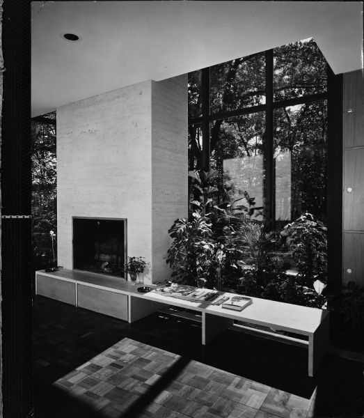 Edward McCormick and Elizabeth Blair House, Keck and Keck Project #500. Project date 1953. George Fred and William Keck were born in Watertown, Wisconsin, and operated an architectural office on Michigan Avenue in Chicago, Illinois. Edward Blair, a former managing partner of William Blair & Company in Chicago, also was the great-grandnephew of Cyrus McCormick, inventor of the McCormick reaper. Mr. Blair was a life trustee at the Art Institute of Chicago, the University of Chicago, Rush University Medical Center and College of the Atlantic. This is a photograph showing the living room fireplace ventilation panels to the right. The Blair house on N. Sheridan Road, Lake Bluff, Illinois.