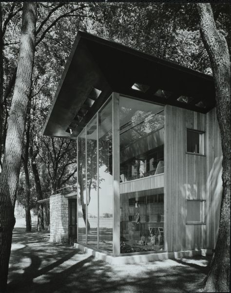 The William and Majel Kellett House was designed by the architectural firm Keck and Keck as Project #243 in 1940.  This photograph shows the two-story, floor to ceiling windows outside living room of the Kellett house in Menasha, Wisconsin. The Fox River is seen in the background.
William Kellett spent his entire professional life at Kimberly Clark Corporation, becoming it's President and eventually retiring in 1964. 
