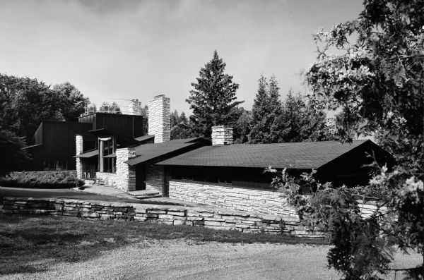 Dr. Jacob R. Buchbinder House was designed by the architectural firm Keck and Keck as Project #244 in 1939. This photograph shows the front of the Buchbinder summer home in Fish Creek. Jacob Buchbinder was a doctor of medicine in Chicago. 