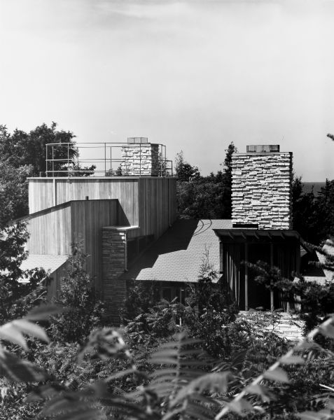Dr. Jacob R. Buchbinder House was designed by the architectural firm Keck and Keck as Project #244 in 1939. This photograph shows the Buchbinder summer home in Fish Creek. Jacob Buchbinder was a doctor of medicine in Chicago. 