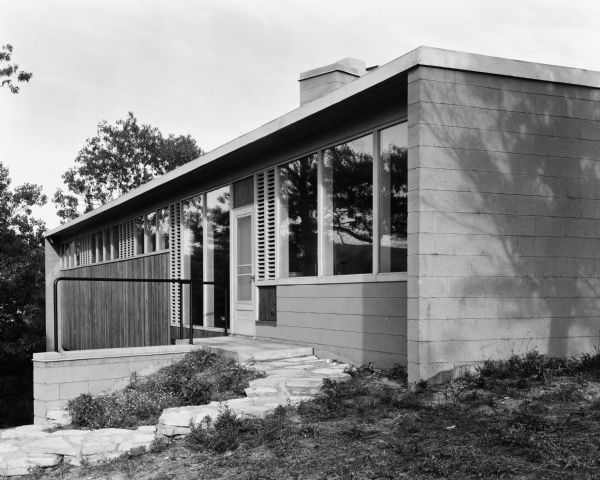The Avery O. Craven House was designed by the architectural firm Keck and Keck as Project #407 in 1949. This photograph shows the front of the Craven House in Dune Acres, Indiana. Avery O. Craven was a nationally known Civil War historian. 