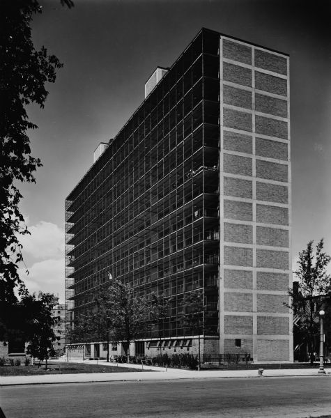 The Chicago Housing Authority's Prairie Avenue Court public house project was designed by the architectural firm Keck and Keck as Project #410 in 1950. The project included 2-story, 7-story, and 14 story housing units. This photograph of the 14-story building shows the south face of the structure. This project was designed using solar energy management principles.  