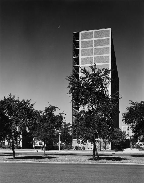 The Chicago Housing Authority's Prairie Avenue Court public house project was designed by the architectural firm Keck and Keck as Project #410 in 1950. The project included 2-story, 7-story, and 14 story housing units. This photograph of the 14-story building shows the east face of the structure. This project was designed with solar energy management principles in mind.  