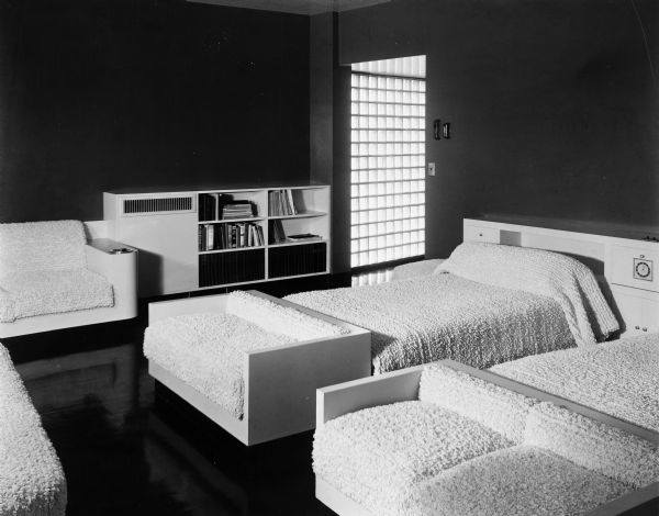 The Bertram and Irma Cahn House was designed by the architectural firm Keck and Keck as Project #213 in 1936. This photograph shows the Master's bedroom in the Cahn house on Green Bay Road in Lake Forest, Illinois. Bertram Cahn was President and Chairman of Kuppenheimer Clothing Manufacturers in Chicago. Irma Cahn, after seeing the House of Tomorrow at the Chicago World's Fair (Century of Progress), wanted to have George Fred design her a "House of the Day After Tomorrow."