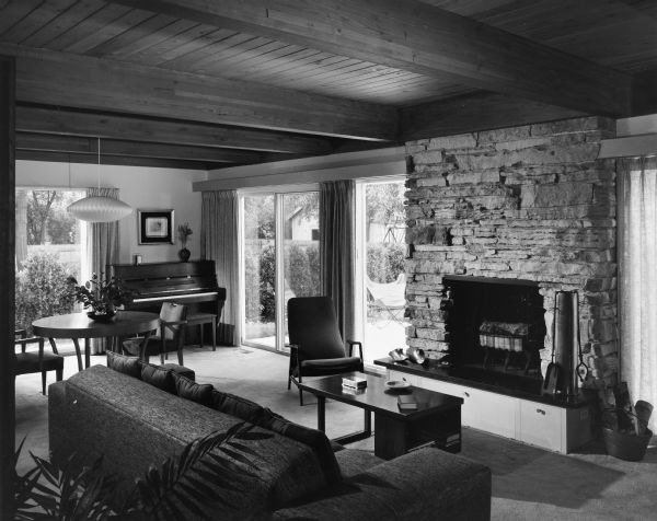 The Cyrus C. DeCoster house was designed by the architectural firm Keck and Keck as Project #827 in 1972. This is a photograph of the living room in the DeCoster House in Evanston, Illinois. Cyrus DeCoster was a Professor of Spanish Literature at Northwestern University for 16 years. 