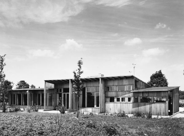 The Hugh and Minna Duncan house was designed by the architectural firm Keck and Keck as Project #268 in 1941. The Duncan house was a Keck "Solar House" and was studied by the Illinois Institute of Technology to measure its energy efficiency. This is a photograph of the back of the DeCoster House in Flossmoor, Illinois. Hugh Duncan was a Sociologist at the University of Chicago. 