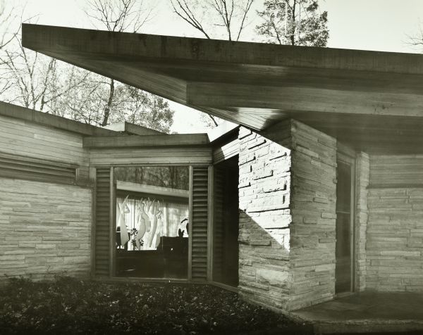 The Abel and Mildred Fagen House was designed by the architectural firm Keck and Keck as Project #387 in 1948. This photograph of the entry to the house also shows an etched glass screen done by Ukrainian born, American artist Alexander Archipenko. The Fagens were very active in the Chicago arts community and interested in cubist art. Salvador Dali created portraits of both Abel and Mildred. 