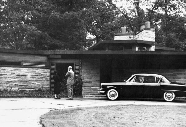 The Abel and Mildred Fagen House was designed by the architectural firm Keck and Keck as Project #387 in 1948. This is a photograph of George Fred and Lucile Keck at the entry to the Fagen house in Lake Forest, Illinois.