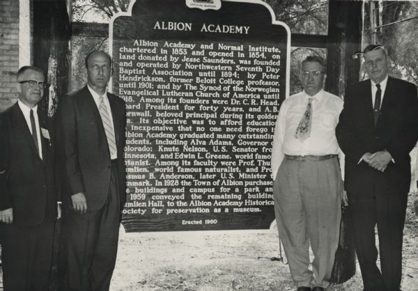 Participants at the dedication of the Albion Academy historical marker, from left to right, include, Judge Sverre Roang, program chairman, Dr. Leslie H. Fishel Jr., director of the Wisconsin State Historical Society, Harold Baum, director of the Albion Historical Society, and Clifford Townsend, president of the Albion Historical Society. The dedication was paired with the reunion of Albion Academy students, and Kumlien Hall, renovated for use as a museum by the Albion Historical Society, was open to the public. 