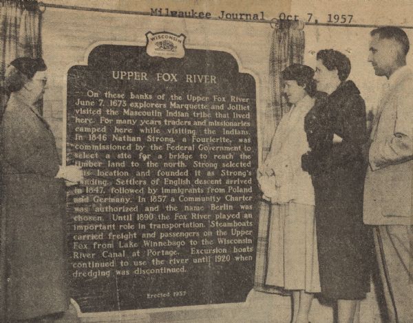 Mrs. Steve McNamara (left), granddaughter of Nathan Strong, the founder of the city of Berlin, then named Strong's Landing, spoke at the dedication ceremony of the Upper Fox River historical marker in Riverside Park in Berlin, about her Strong family history. Berlin Park Board members, Mrs. Edwin Winkoski (right of marker) and Mrs. Karl Baehr (middle) were present along with the Chairman of the Berlin Park Board, L.A. Blackbourn (far right), master of ceremonies, to dedicate the historical marker.     