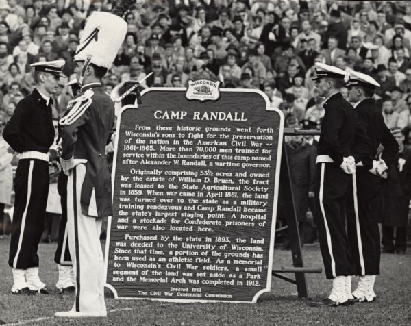 The dedication ceremony of the Camp Randall historical marker was part of the halftime entertainment of the Wisconsin versus Ohio State football game. Governor Gaylord Nelson and University President Conrad Elvehjem were scheduled to play a role in the dedication ceremony.