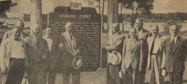 Officials gathered to dedicate the Knaggs Ferry historical marker in Oshkosh. The officials included, from left to right, Edward Hamilton, vice-president of the Winnebago County Historical Society, E.A. Clemans, president of the Winnebago County Historical Society, Assemblyman Harvey Abraham (behind Clemans), Anthony Herber, Rainbow Park board member, Herman Hoxtel, chairman of the Rainbow Park board, Mayor Ernest Siewert, Robert Luedtke, Rainbow Park board member, Marshall Muscavitch, Rainbow Park board member, Senator William Draheim of Neenah, and Warner Geiger, director of the Winnebago County Historical Society.  