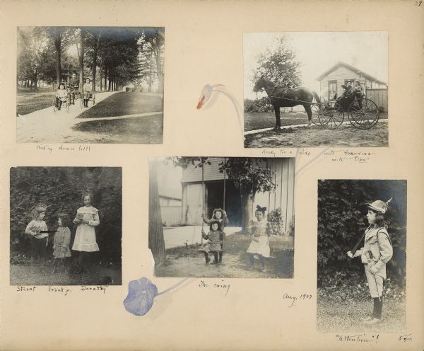 A hand-painted nasturtium bud and leaf decorate an album page with five photographs of the children of Frank and Louise Mears Fargo. At top left, Frank Jr., aged three years, and his sister Dorothy, nine, are riding tricycles on a sidewalk as Stuart, five, is pulling a wagon behind them. At top right, the children, with their grandmother Elizabeth Farnsworth Mears, are riding in a carriage pulled by the horse Dan. There is a cottage or shed in the background. At bottom left, Stuart and Dorothy, standing on either side of Frank, are holding kittens. Dorothy and Frank are sitting on swings in the bottom center photograph; Stuart is standing behind Frank. A carriage house is in the background. At bottom right, Stuart is posing in profile holding a toy rifle in his right hand; a sword is hanging on his left side. He is wearing a military-style helmet.