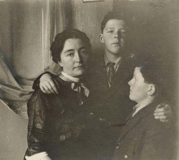 Group portrait, with Stuart, center, and Frank B. Fargo Jr. posing with their "Aunt Nellie," Helen Farnsworth Mears. The boys are wearing jackets and neckties; Mears is wearing a dark patterned blouse with a bow at her neck.