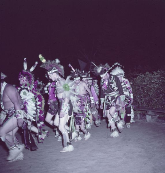 Native American Indian men are performing the contest dance at the Stand Rock Indian Ceremonial.