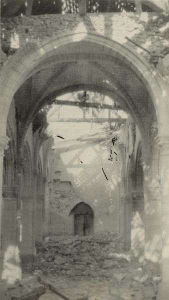 View of interior of ruined church. Captioned:"Interior of ruined church at St. Hilaire-le-Grand."