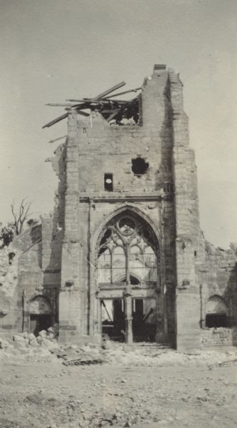 View of exterior of a church in Cormicy which was hit by opposing forces and almost completely destroyed. Caption reads: "Churches, as the most prominent buildings in French villages, are usually the first thing to be hit. This one is at Cormicy."