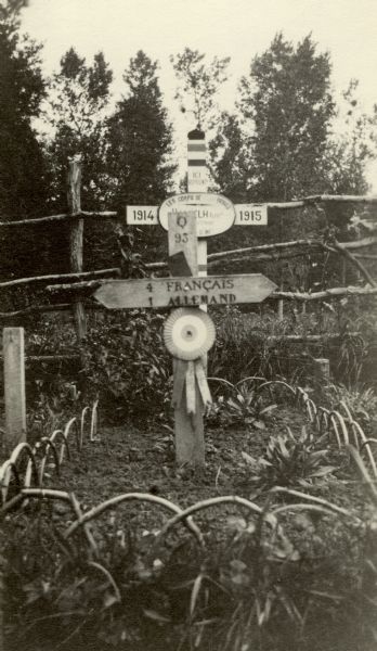 A memorial to those who died with honor. Caption reads: "A common sight in the wake of the battle of the Marne."