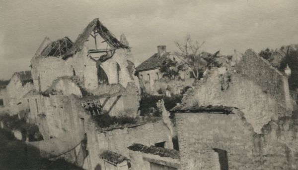 Elevated view of a village in France that has been totally destroyed by the war. Caption reads: "The utter ruin and desolation of a typical bombarded village in Northern France."