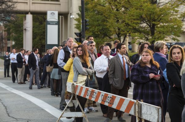 A line of men and women stretches across the closed street, waiting to enter the Republican presidential debate. 