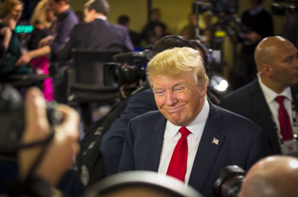 Donald Trump talking to members of the press in the spin room of the Republican presidential debates.