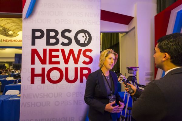A Fox 6 News reporter is interviewing Wisconsin Democratic Chair Martha Laning in the spin room at the Democratic presidential debate.