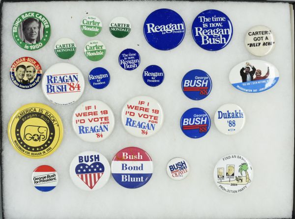 Framed assortment of political campaign buttons for Jimmy Carter with running mate Walter Mondale, Ronald Reagan with running mate George H.W. Bush, as well as presidential nominees Michael Dukakis and George H.W. Bush.