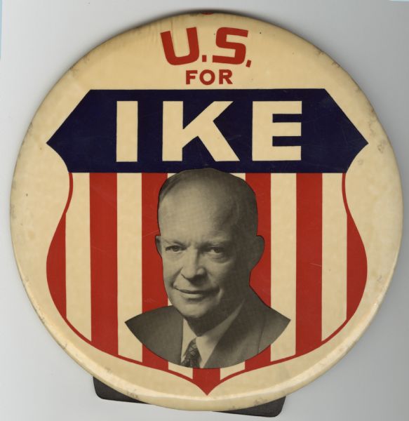 A political campaign button with a head and shoulders portrait of Dwight D. Eisenhower on a red, white and blue shield on a white background. The text reads: "U.S. for Ike."