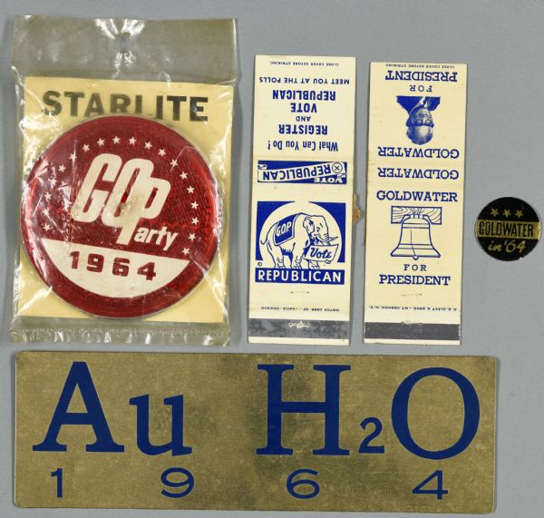 Five items in an assortment of political campaign ephemera for Barry Goldwater. Includes a reflector with white text on a red reflective background that reads: "GOParty 1964." Two matchbooks, one that reads: "Goldwater for President," and one that reads: "Vote Republican." A small sticker in gold and black reads: "Goldwater in '64." A gold metal sign with blue text reads: "Au H2O 1964."