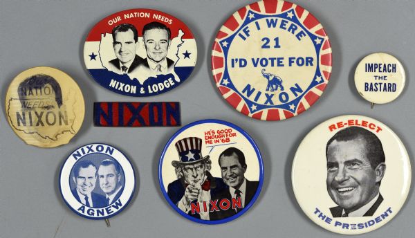 An assortment of eight political campaign buttons for Richard Nixon, along with Agnew and Lodge. The buttons include a homemade metal sign with red and blue copper enamel that reads: "NIXON"; a lenticular button which reads: "Our Nation Needs Nixon," with an outline of the United States on one side and a portrait of Richard Nixon's head on the other; another button is red, white, and blue and has an image of Uncle Sam and Richard Nixon which reads: "He's Good enough for me in '68."
