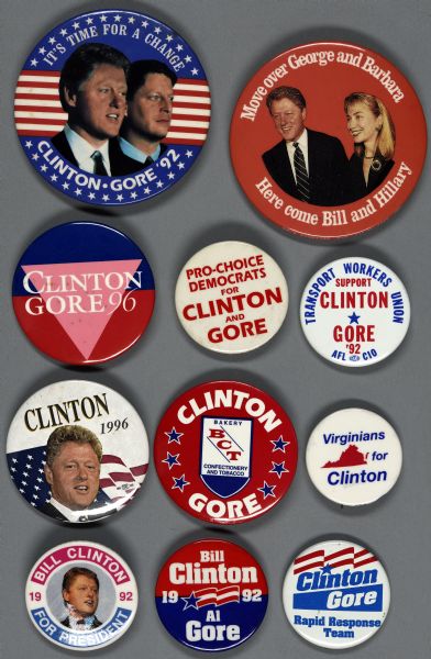 Eleven assorted presidential political campaign buttons for Bill Clinton and Al Gore. One button is orange white text wrapped around the outside that reads: "Move over George and Barbara, Here come Bill and Hillary," and includes a portrait of Bill and Hillary Clinton in the center. Another of the buttons is white with blue and red text and reads: "Transport Workers Union support Clinton Gore '92 AFL C10."